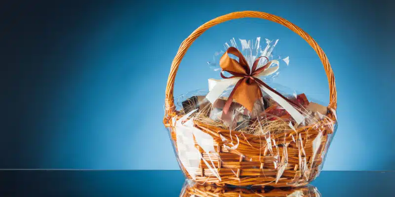 A basket that is available to purchase from Maid To Please that has no shortage of goodies.